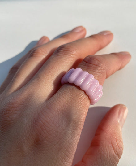 pink cadillac ring on index finger