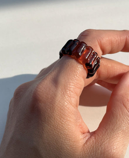 Sienna Brown Textured ring on index finger 